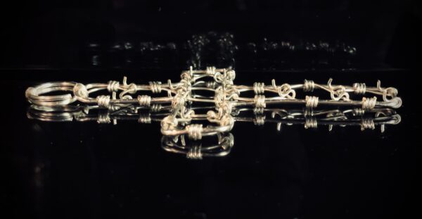 A cross-shaped cilice made of metal complete with traditional manila rope tie-cord - Image 4
