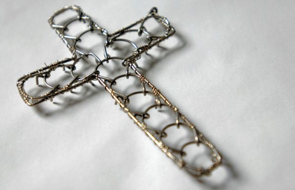 A cross-shaped cilice made of metal complete with traditional manila rope tie-cord-43